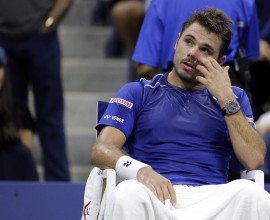 Stan Wawrinka, of Switzerland, takes a break between games during a semifinal match against Roger Federer, of Switzerland, at the U.S. Open tennis tournament, Friday, Sept. 11, 2015, in New York. (AP Photo/David Goldman)